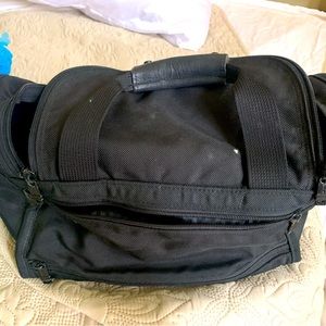 Tumi tote bag / dog carrier.  Black , has 4 different separate areas